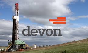 Devon logo over a land oil rig with blue skys