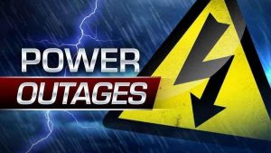 caution sign with power outages in large words
