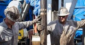 two oil workers on rig