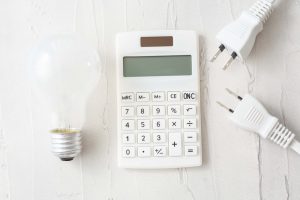 light bulb, calculator and extension cord